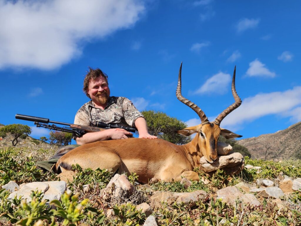 Hunter with a buck Hunter with a buck