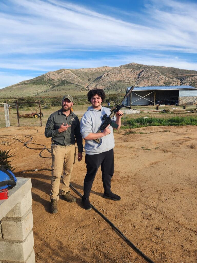 Posing_With_gun Hunters posing with a gun
